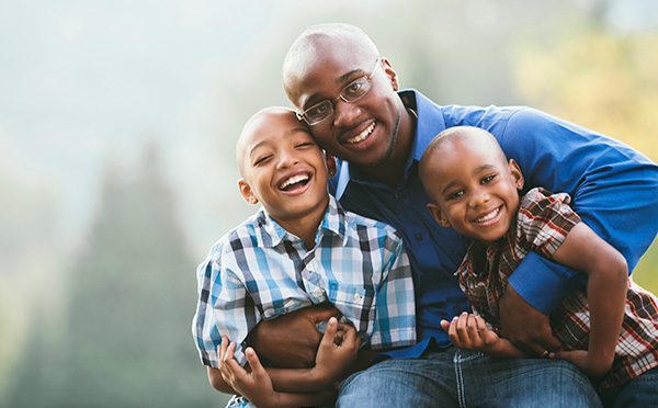 Father smiling with children