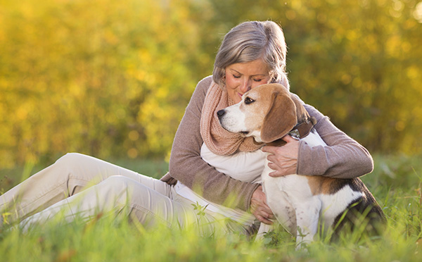 Woman hugging dog